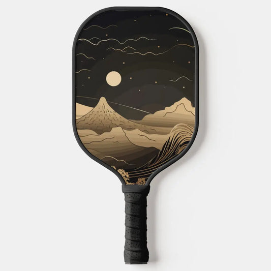 Pickleball paddle with mountain and moon design on a white background