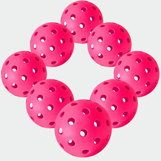 Pink perforated balls arranged in a circular pattern on a white background